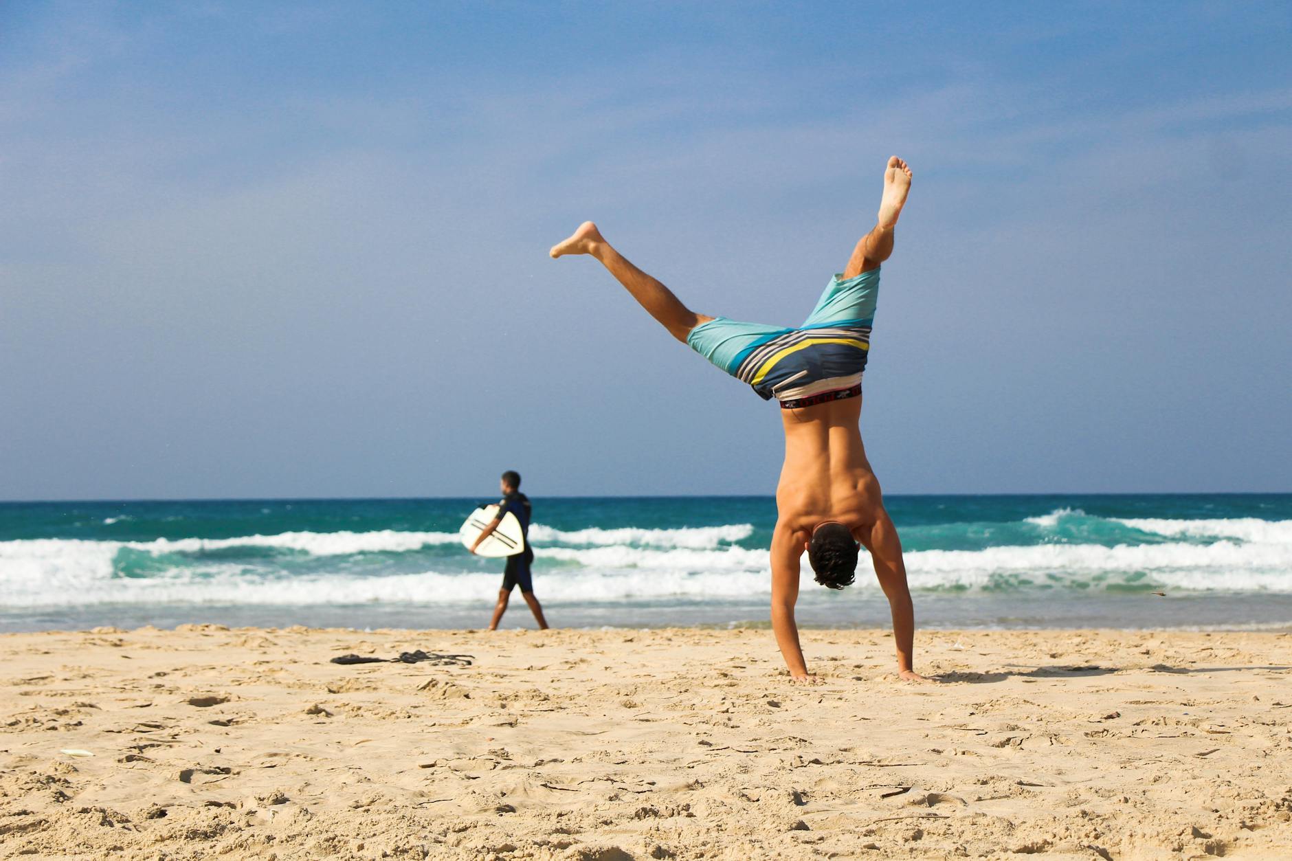 image beach and one person doing pirouette